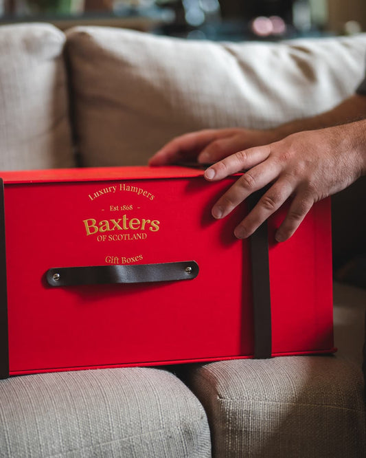 A red hamper being given to a university student