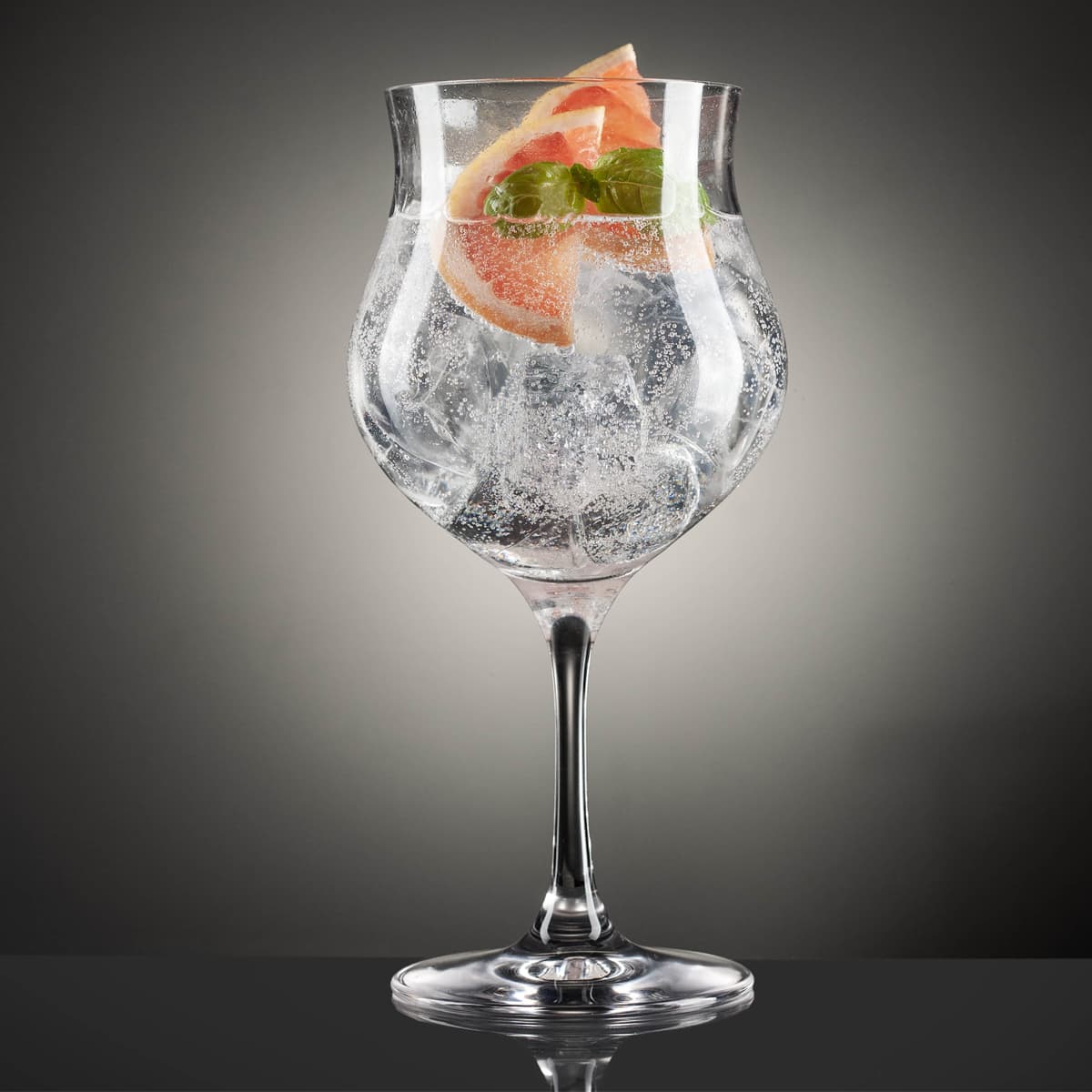 Glencairn Gin Goblet filled with a drink and fruit